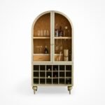 "Elegant arched bar cabinet made of sheesham wood, includes a bottle rack, glass holders, and ample storage space