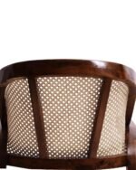 wooden cane armchair with natural rattan back and cushioned beige seat