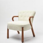 Armetta handcrafted sheesham wood boucle lounge chair with curved arms and cushioned seat