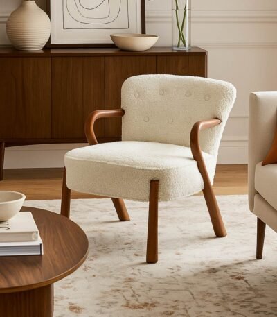 Armetta handcrafted sheesham wood boucle lounge chair with curved arms and cushioned seat