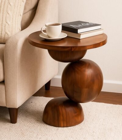 Artistic wooden sphere side table with stacked sculptural base and smooth round top in rich honey finish.