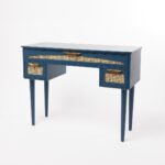 Rattan study table in Sheesham wood with deep blue finish and cane drawers