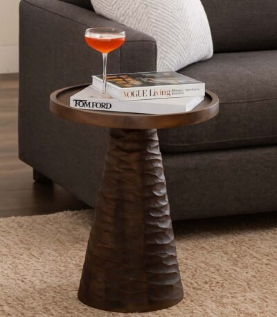 Dark wooden end and side table with a round top and hand-carved conical base in natural Sheesham wood.