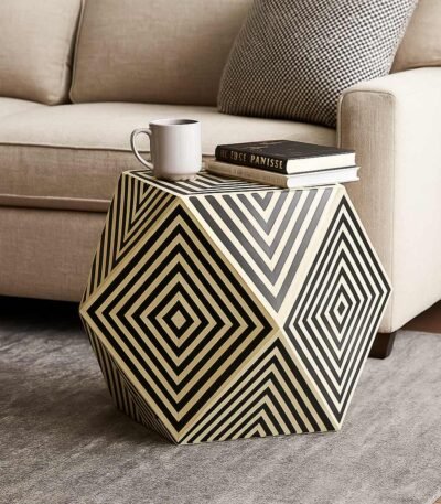 Geometric bone inlay black and white optical illusion side table with bold diamond pattern and hexagonal design.