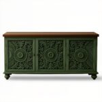 Distressed green mango wood console table with intricate hand-carved floral motifs and brown wooden top.