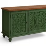 Distressed green mango wood console table with intricate hand-carved floral motifs and brown wooden top.