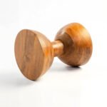 Handcrafted round solid wood side table with natural finish and sculptural hourglass base.