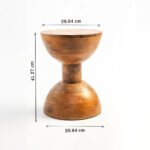 Handcrafted round solid wood side table with natural finish and sculptural hourglass base.