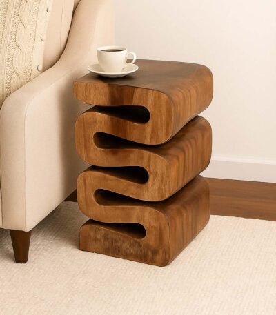 Sculptural wooden end table with modern wavy design and natural Sheesham wood finish.