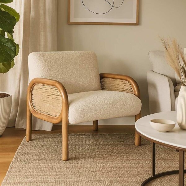 Handcrafted solid wood cane chair with curved Sheesham wood frame, natural cane sides, and plush bouclé cushions.