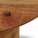 Round mango wood side table with natural finish and smooth cylindrical pedestal base.