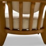 Handcrafted solid wood lounge chair with artistic backrest and circular cushioned seat in cream upholstery – luxury designer accent chair