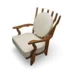 Handcrafted solid wood lounge chair with artistic backrest and circular cushioned seat in cream upholstery – luxury designer accent chair