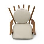 Handcrafted solid wood lounge chair with artistic backrest and circular cushioned seat in cream upholstery – luxury designer accent chair