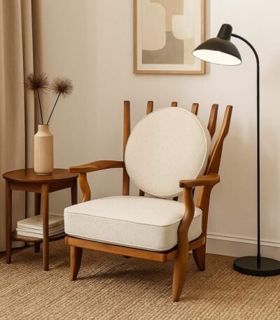 Handcrafted solid wood lounge chair with artistic backrest and circular cushioned seat in cream upholstery – luxury designer accent chair