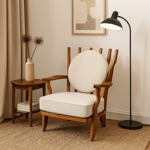 Handcrafted solid wood lounge chair with artistic backrest and circular cushioned seat in cream upholstery – luxury designer accent chair