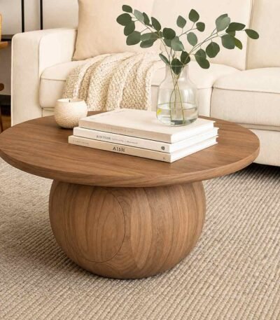 Aurea Round Sheesham Wood Coffee Table with sculptural pedestal base