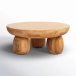 Orvian handcrafted round solid wood coffee table with sculpted legs