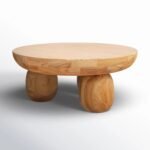 Orvian handcrafted round solid wood coffee table with sculpted legs