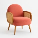 Handcrafted solid wood rattan armchair with coral cushioned seat