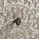 White distressed mango wood bedside table with hand-carved floral drawer