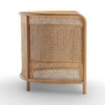 Tejasvi rattan lounge chair with curved cane sides and upholstered seat