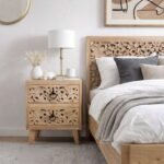 Carved bedside table in solid sheesham wood with handcarved floral design and natural finish