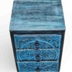 Solid wood handcarved bedside table crafted from mango wood featuring floral carving and distressed blue finish