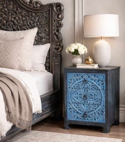 Solid wood handcarved bedside table crafted from mango wood featuring floral carving and distressed blue finish