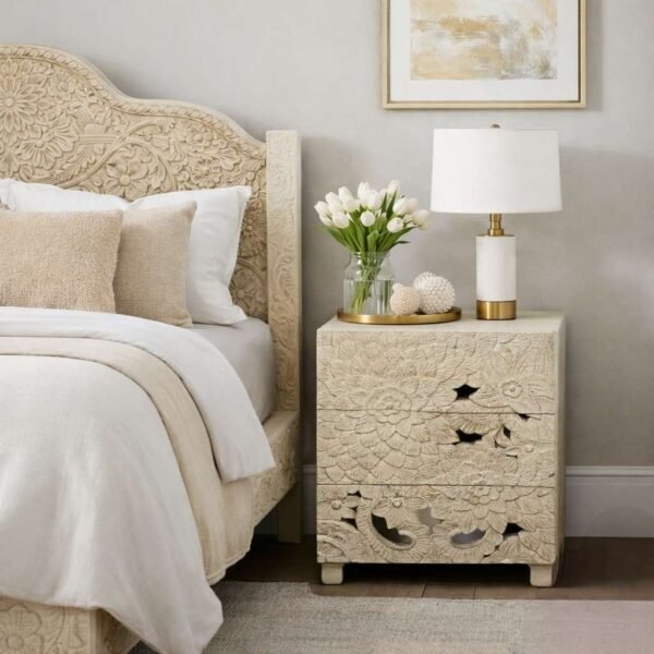 Handcarved bedside table made from solid mango wood featuring detailed floral carvings and three storage drawers