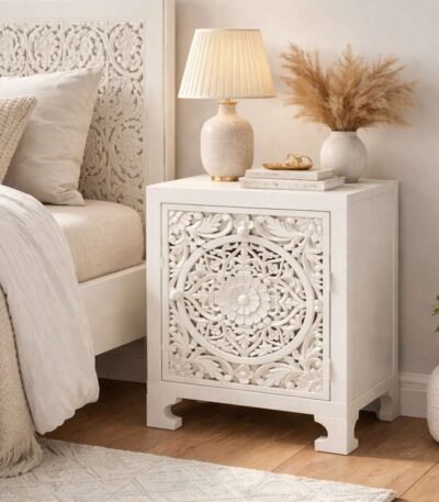 Carved bedside table handcrafted from solid mango wood with floral detailing and white polished finish