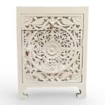 Carved bedside table handcrafted from solid mango wood with floral detailing and white polished finish