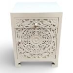 Carved bedside table handcrafted from solid mango wood with floral detailing and white polished finish