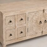 Handcarved wooden TV cabinet in distressed mango wood finish with floral carved doors and drawers