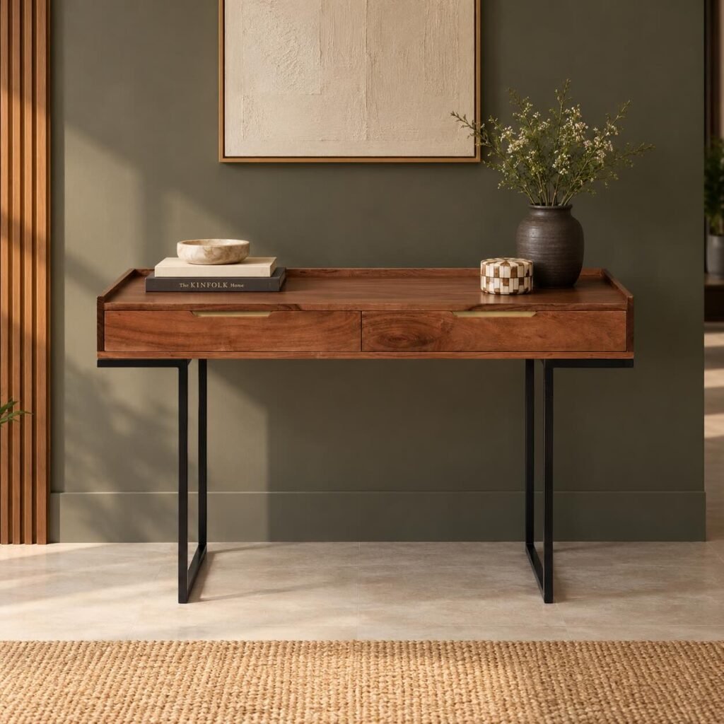Sheesham Wood Study Desk with two wooden drawers, brass-finish handles and black iron trestle legs in honey brown finish.
