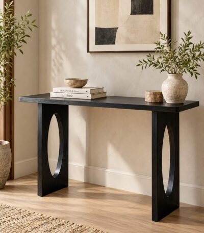 Sheesham Wood Console Table with sculptural oval cut-out legs in black finish.