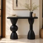 Solid Wood Console Table with sculptural geometric legs in black finish.