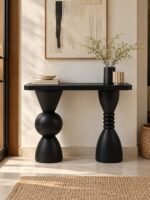 Solid Wood Console Table with sculptural geometric legs in black finish.