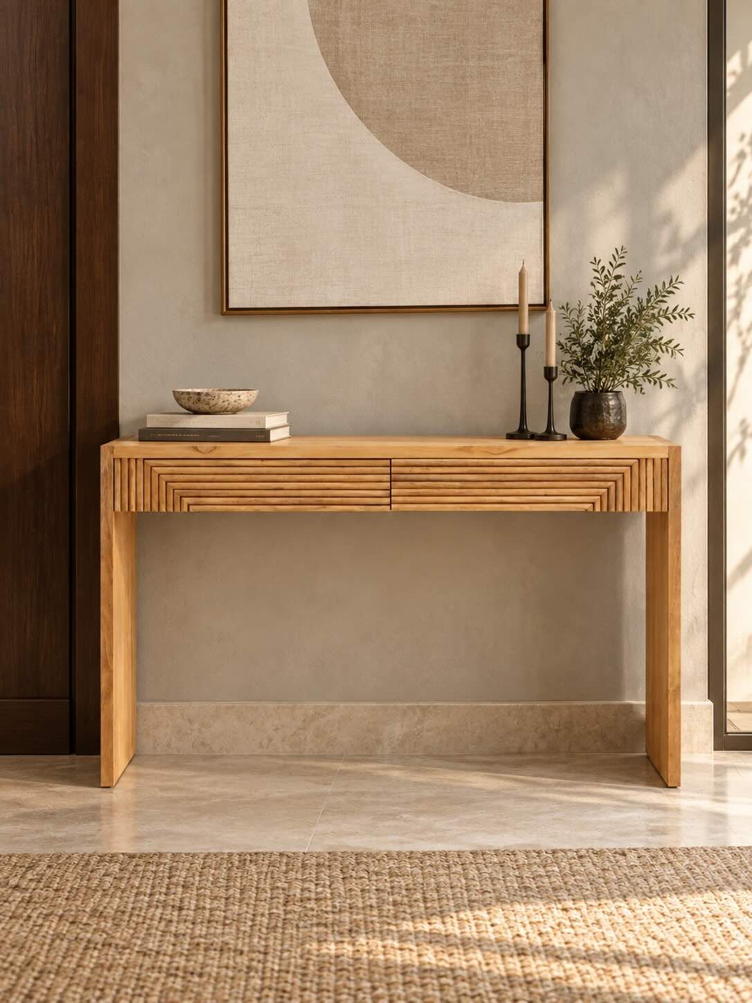 Elowen Teak wood console table featuring two geometric detailed drawers and a clean natural finish. Teak Wood Console Table with geometric fluted drawers in natural finish.