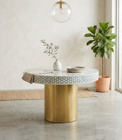 Aurevyn round bone inlay dining table with blue and white geometric pattern and gold-tone cylindrical base