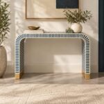 Bone Inlay Console Table with navy blue and ivory striped pattern, curved waterfall legs and gold-toned base accents.