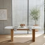 Caldrisse marble top dining table for six with natural solid wood base and sculpted fluted legs
