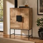 Drevanto solid mango wood wine bar cabinet with geometric panel doors, 12 bottle holders, and a dark iron stand in natural finish.