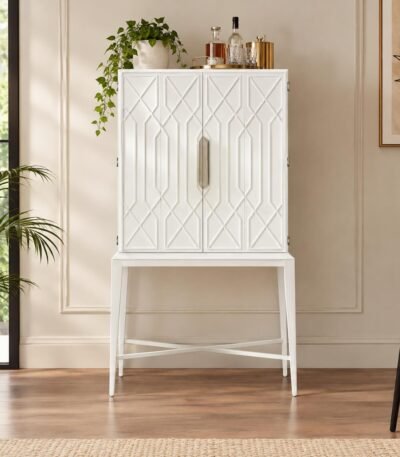 Elarvique white solid wood bar cabinet with geometric raised-panel doors, metallic handle, and tapered legs