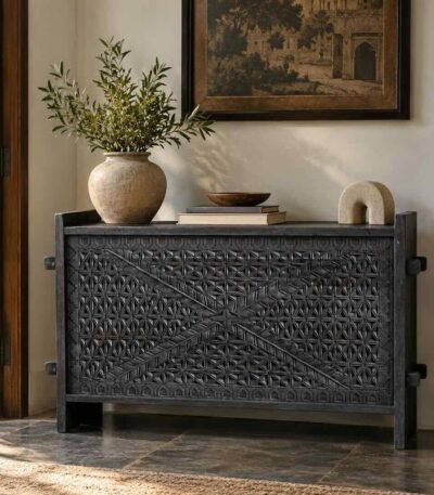 Carved Wooden Storage Trunk with geometric hand-carved front, crossed detailing and black matte mango wood finish.