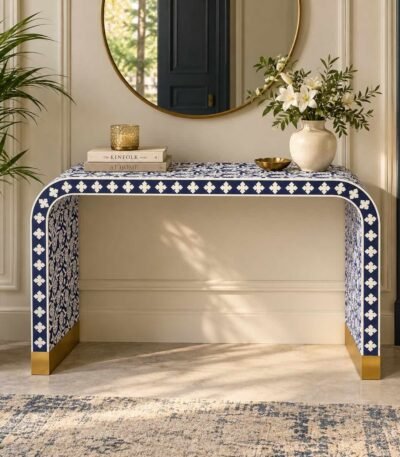 Bone Inlay Console Table with navy blue and ivory floral patterns, curved waterfall legs and gold-toned base accents.
