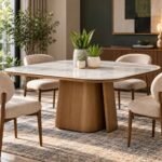 Solid Wood Marble Dining Table with white marble top, natural grey veining and sculptural walnut brown pedestal base