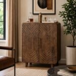 Orvessan geometric carved solid wood bar cabinet with sculpted double doors in warm brown finish