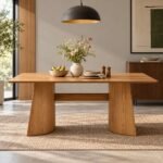 Sorell natural wood curved leg dining table for six people with rectangular tabletop, sculptural wooden panel supports and natural finish.