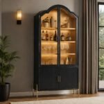Vaelthorne black solid wood bar cabinet with arched glass doors, natural wood shelves, and gold-tone metal base